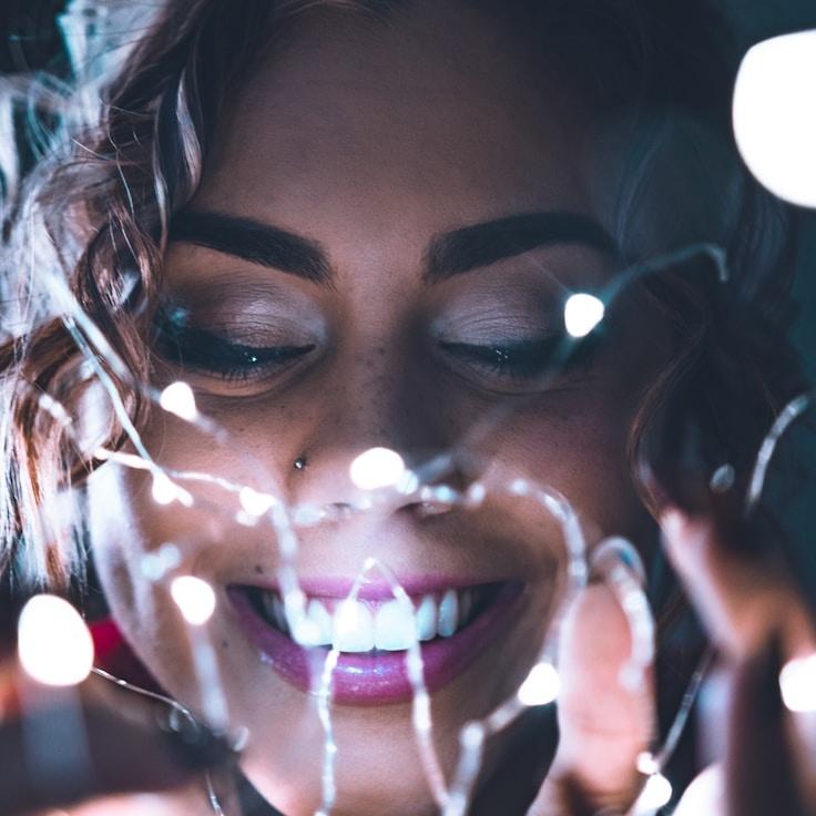 Kaveri Mehta, Lead Design Curator at Orivencia Dynamics, reviewing corporate floral arrangements